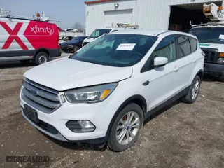 2017 Ford Escape SE with VIN 1FMCU9GD2HUE56001, listed as a IAAI auction lot 41818422 with 57,597 mi miles. Bid and sale history available at carsss.com. Image 2.