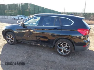 2018 BMW X1 xDrive28i with VIN WBXHT3C36J5L29746, listed as a IAAI auction lot 41547100 with 103,420 mi miles and . Bid and sale history available at DreamBid. Image 3.