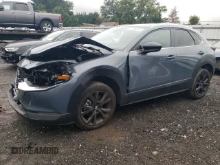 2022 Mazda CX-30 2.5 S Carbon Edition with VIN 3MVDMBCLXNM400593, listed as a Copart auction lot 73709824 with 61,616 mi miles and Salvage Title. Bid and sale history available at carsss.com. Image 1.