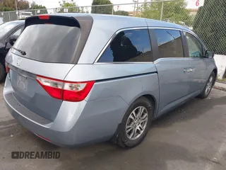 2012 Honda Odyssey EX-L with VIN 5FNRL5H60CB095086, listed as a IAAI auction lot 42251330 with 144,232 mi miles and . Bid and sale history available at DreamBid. Image 4.