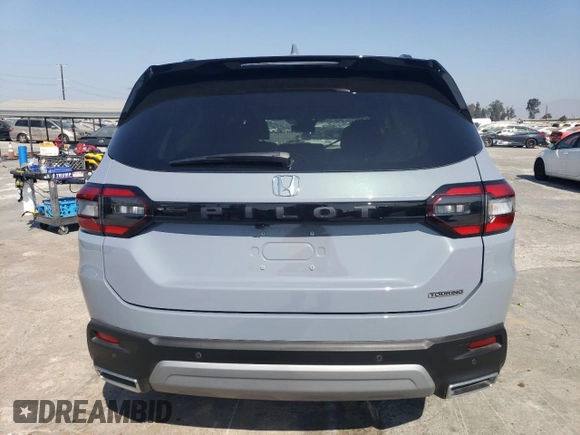2023 Honda Pilot Touring with VIN 5FNYG2H7XPB011420, listed as a Copart auction lot 69799314 with 9,601 mi miles and Salvage Title. Bid and sale history available at DreamBid. Image 6.