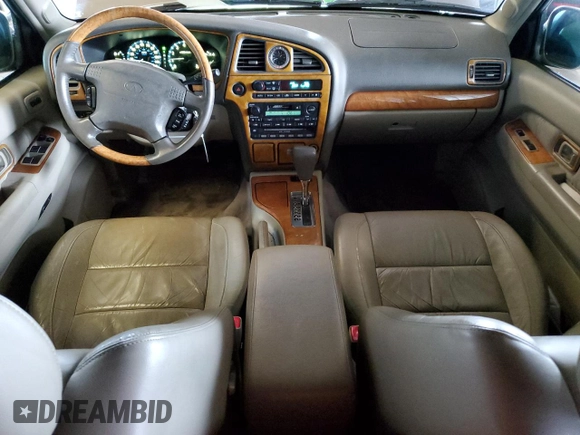 2001 Infiniti QX4 with VIN JNRDR09X21W204448, listed as a Copart auction lot 82619574 with 114,520 mi miles and Salvage Title. Bid and sale history available at DreamBid. Image 8.