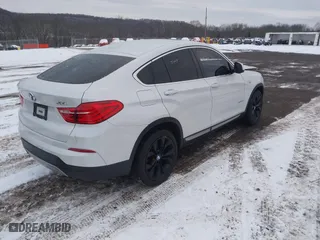2018 BMW X4 xDrive28i with VIN 5UXXW3C5XJ0T82043, listed as a IAAI auction lot 41246495 with 106,606 mi miles. Bid and sale history available at carsss.com. Image 4.