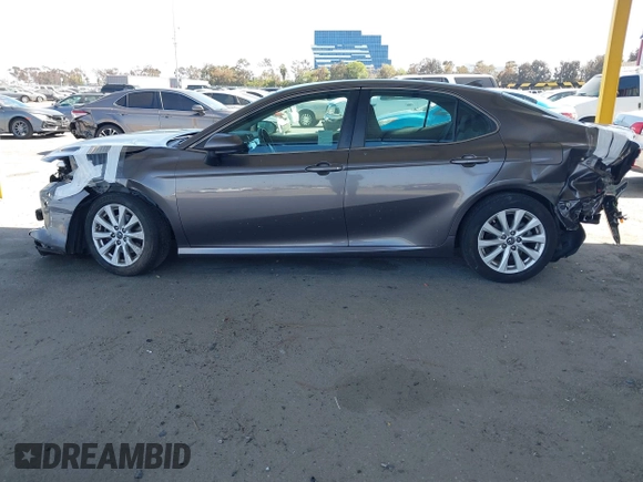 2019 Toyota Camry LE with VIN 4T1B11HK8KU204599, listed as a IAAI auction lot 42096889 with 76,518 mi miles and . Bid and sale history available at DreamBid. Image 15.