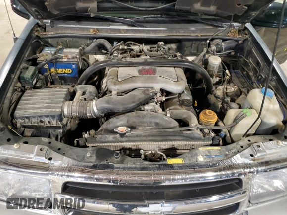 2002 Chevrolet Tracker LT z VIN 2CNBJ634126949974, wystawiony jako Copart lot #54819695 z przebiegiem 200 895 mil mil oraz Szkoda całkowita • Salvage title. Historia ofert i sprzedaży dostępna na DreamBid. Obrazek 12.