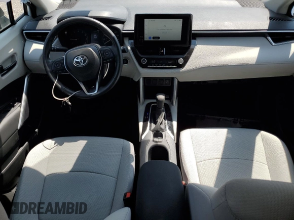 2023 Toyota Corolla Cross LE with VIN 7MUCAABG3PV060880, listed as a Copart auction lot 59664915 with 18,246 mi miles and Salvage title. Bid and sale history available at DreamBid. Image 8.