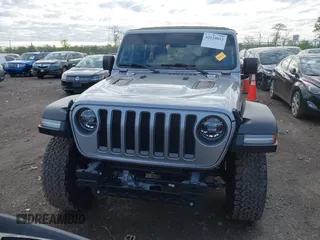 2021 Jeep Wrangler Unlimited Rubicon with VIN 1C4HJXFNXMW560512, listed as a IAAI auction lot 42124812 with 18,034 mi miles and . Bid and sale history available at DreamBid. Image 13.