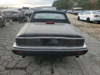 1996 Jaguar XJS with VIN SAJNX2740TC225643, listed as a Copart auction lot 80975784 with 98,427 mi miles and Salvage Title. Bid and sale history available at carsss.com. Image 6.