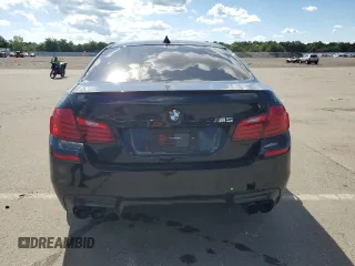 2014 BMW M5 z VIN WBSFV9C53ED594132, wystawiony jako Copart lot #67114384 z przebiegiem 89 020 mil mil oraz Szkoda całkowita • Salvage title. Historia ofert i sprzedaży dostępna na DreamBid. Obrazek 6.