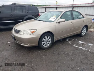 2002 Toyota Camry LE z VIN 4T1BE32K52U086150, wystawiony jako IAAI lot #42126685 z przebiegiem 175 212 mil mil oraz . Historia ofert i sprzedaży dostępna na DreamBid. Obrazek 2.