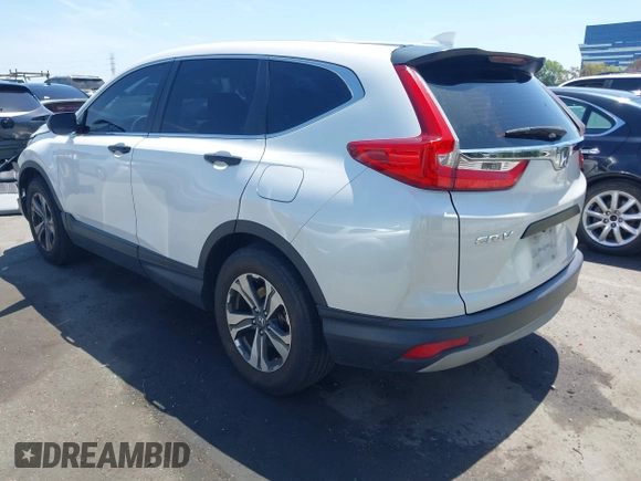 2019 Honda CR-V LX with VIN 2HKRW5H33KH407463, listed as a IAAI auction lot 42034584 with 85,454 mi miles and . Bid and sale history available at DreamBid. Image 3.