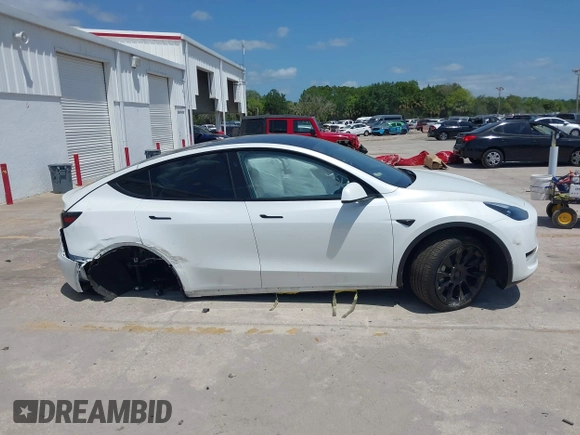 2023 Tesla Model Y Long Range with VIN 7SAYGDEE7PF865539, listed as a IAAI auction lot 42109673 with 34,923 mi miles and . Bid and sale history available at DreamBid. Image 13.