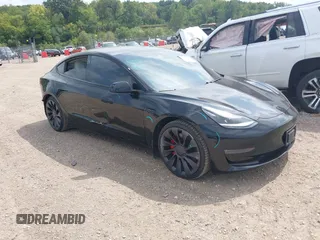 2021 Tesla Model 3 Performance with VIN 5YJ3E1EC5MF919278, listed as a IAAI auction lot 40194677 with 50,484 mi miles and . Bid and sale history available at carsss.com. Image 1.