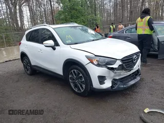 2016 Mazda CX-5 Grand Touring with VIN JM3KE4DY3G0838204, listed as a IAAI auction lot 41961049 with 98,918 mi miles and . Bid and sale history available at carsss.com. Image 1.
