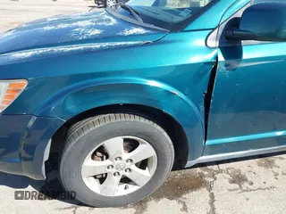 2009 Dodge Journey SXT with VIN 3D4GG57V09T170094, listed as a IAAI auction lot 41867577 with 122,831 mi miles. Bid and sale history available at carsss.com. Image 12.