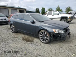 2015 Volvo V60 T5 Drive-E Premier with VIN YV140MEKXF1259241, listed as a Copart auction lot 66890004 with 117,600 mi miles and Salvage Title. Bid and sale history available at carsss.com. Image 4.