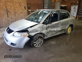 2010 Suzuki SX4 with VIN JS2YC5A49A6310256, listed as a Copart auction lot 73210584 with 135,021 mi miles and Salvage Title. Bid and sale history available at DreamBid. Image 1.