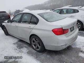 2014 BMW 3 Series 328i with VIN WBA3C1C51EK106435, listed as a IAAI auction lot 41202983 with 142,135 mi miles. Bid and sale history available at carsss.com. Image 3.