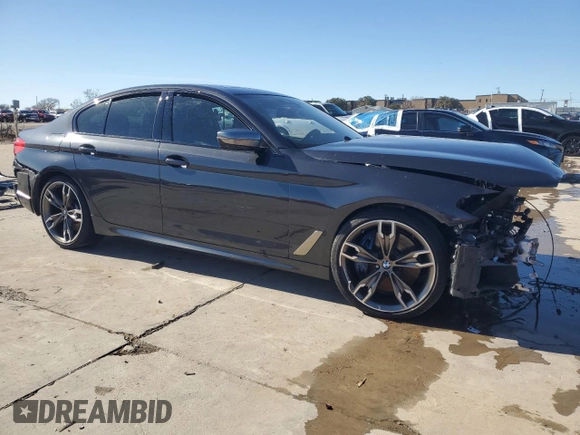 2020 BMW 5 Series M550i xDrive with VIN WBAJS7C07LCD97275, listed as a Copart auction lot 85764434 with Not provided miles and Clean title. Bid and sale history available at DreamBid. Image 4.