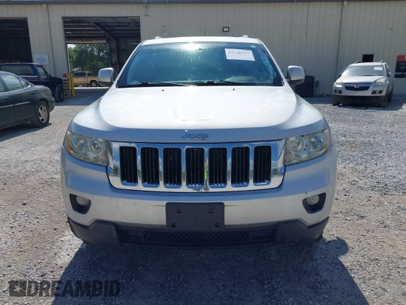 2011 Jeep Grand Cherokee Laredo with VIN 1J4RR4GG2BC714893, listed as a IAAI auction lot 42750763 with 184,475 mi miles and . Bid and sale history available at DreamBid. Image 6.