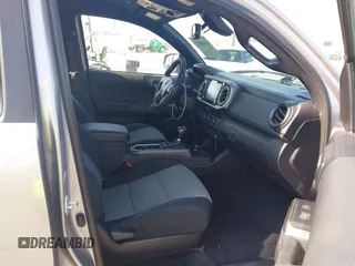 2021 Toyota Tacoma SR with VIN 5TFCZ5AN6MX270972, listed as a IAAI auction lot 42460823 with 76,062 mi miles and . Bid and sale history available at DreamBid. Image 5.