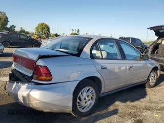 1999 Saturn SL with VIN 1G8ZK5274XZ367394, listed as a Copart auction lot 63863795 with 73,197 mi miles and Salvage title. Bid and sale history available at DreamBid. Image 3.