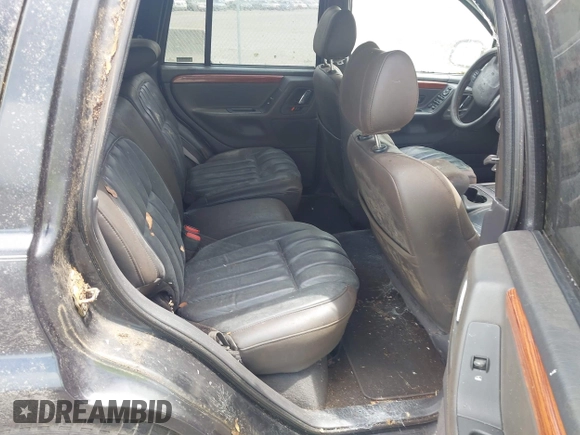 1999 Jeep Grand Cherokee Limited with VIN 1J4GW68N5XC702303, listed as a IAAI auction lot 42501995 with Not provided miles and . Bid and sale history available at DreamBid. Image 8.