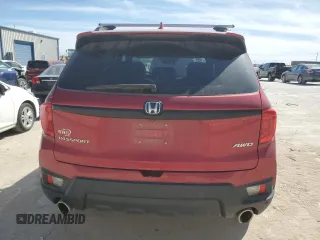 2023 Honda Passport EX-L with VIN 5FNYF8H57PB007264, listed as a Copart auction lot 48942955 with 18,013 mi miles and Salvage Title. Bid and sale history available at DreamBid. Image 6.