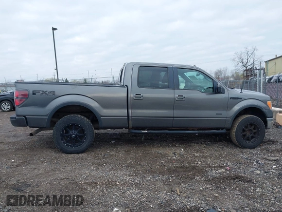 2011 Ford F-150 XLT with VIN 1FTFW1ET4BFC23725, listed as a IAAI auction lot 42018932 with 323,160 mi miles. Bid and sale history available at carsss.com. Image 14.