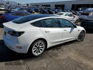 2023 Tesla Model 3 with VIN 5YJ3E1EA7PF450343, listed as a Copart auction lot 52446595 with 36,137 mi miles and Salvage Title. Bid and sale history available at DreamBid. Image 3.