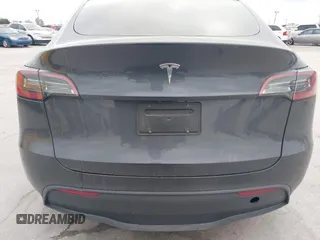 2024 Tesla Model Y with VIN 7SAYGDED3RF002246, listed as a IAAI auction lot 41566184 with 10,316 mi miles and . Bid and sale history available at DreamBid. Image 15.