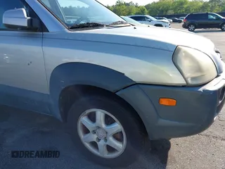 2005 Hyundai Tucson GLS with VIN KM8JN12D65U244033, listed as a IAAI auction lot 41998302 with 219,205 mi miles. Bid and sale history available at carsss.com. Image 12.