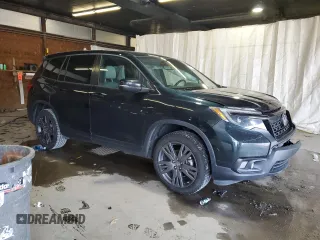 2020 Honda Passport EX-L with VIN 5FNYF8H57LB011549, listed as a Copart auction lot 59123735 with 127,797 mi miles and Salvage title. Bid and sale history available at DreamBid. Image 4.