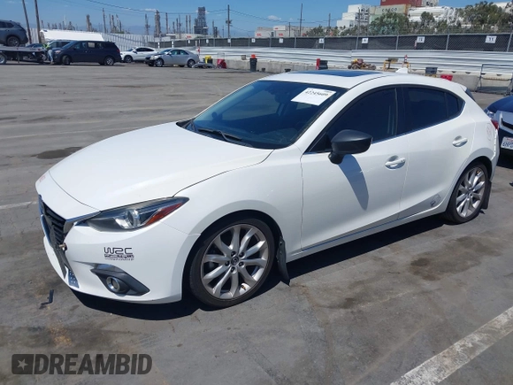 2015 Mazda 3 S Grand Touring with VIN JM1BM1M39F1233093, listed as a IAAI auction lot 42245609 with 137,487 mi miles and . Bid and sale history available at DreamBid. Image 2.