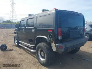 2005 Hummer H2 SUV with VIN 5GRGN23U05H128420, listed as a IAAI auction lot 41983395 with 194,925 mi miles. Bid and sale history available at carsss.com. Image 3.