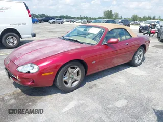1997 Jaguar XK with VIN SAJGX2743VC017588, listed as a IAAI auction lot 42055716 with 66,052 mi miles and . Bid and sale history available at DreamBid. Image 2.