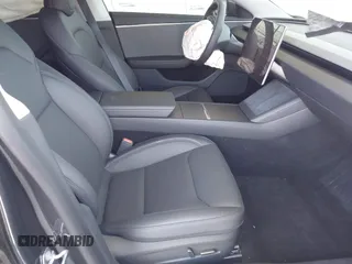 2025 Tesla Model 3 Long Range with VIN 5YJ3E1EA5SF978214, listed as a IAAI auction lot 42525444 with 6,489 mi miles and . Bid and sale history available at DreamBid. Image 5.