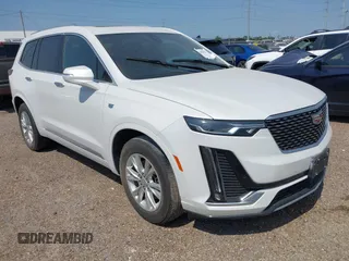 2023 Cadillac XT6 FWD Luxury z VIN 1GYKPAR4XPZ182533, wystawiony jako IAAI lot #42078937 z przebiegiem 31 248 mil mil oraz . Historia ofert i sprzedaży dostępna na DreamBid. Obrazek 1.