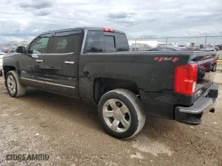 2018 Chevrolet Silverado 1500 LTZ with VIN 3GCUKSEC2JG164258, listed as a Copart auction lot 70305844 with 105,074 mi miles and Salvage Title. Bid and sale history available at carsss.com. Image 2.