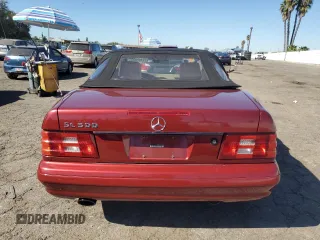 1999 Mercedes-Benz SL-Class with VIN WDBFA68F3XF184908, listed as a Copart auction lot 77165784 with 67,408 mi miles and Salvage Title. Bid and sale history available at carsss.com. Image 6.