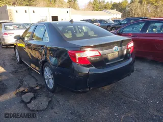 2012 Toyota Camry Hybrid XLE with VIN 4T1BD1FK3CU030064, listed as a IAAI auction lot 41872634 with 373,897 mi miles. Bid and sale history available at carsss.com. Image 3.
