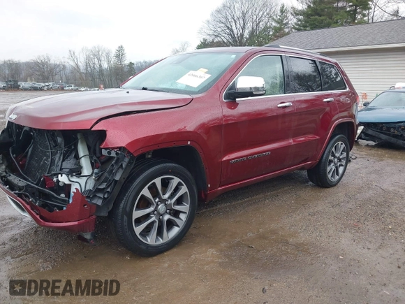 2017 Jeep Grand Cherokee Overland with VIN 1C4RJFCG5HC854024, listed as a IAAI auction lot 42006307 with 118,640 mi miles. Bid and sale history available at carsss.com. Image 2.