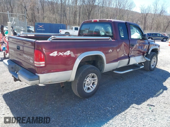 2003 Dodge Dakota SLT with VIN 1D7HG42N33S369870, listed as a IAAI auction lot 41826771 with 214,840 mi miles. Bid and sale history available at carsss.com. Image 4.
