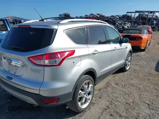 2016 Ford Escape Titanium with VIN 1FMCU0J94GUB11776, listed as a IAAI auction lot 41945655 with 119,949 mi miles. Bid and sale history available at carsss.com. Image 4.