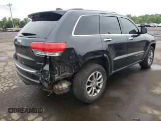 2014 Jeep Grand Cherokee Limited z VIN 1C4RJFBG7EC546642, wystawiony jako Copart lot #61445615 z przebiegiem 128 921 mil mil oraz Szkoda całkowita • Salvage title. Historia ofert i sprzedaży dostępna na DreamBid. Obrazek 3.