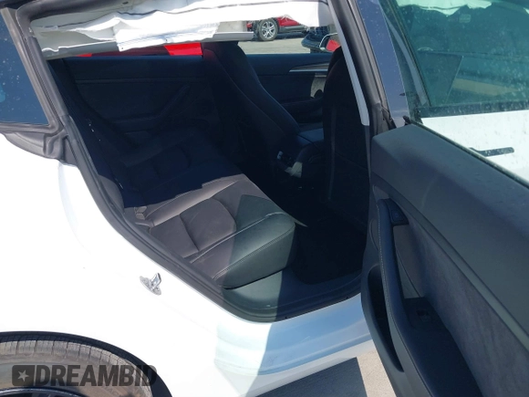 2023 Tesla Model 3 with VIN 5YJ3E1EA9PF585632, listed as a IAAI auction lot 40520993 with 7,775 mi miles and . Bid and sale history available at DreamBid. Image 8.