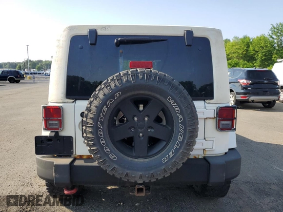 2013 Jeep Wrangler Unlimited Sport z VIN 1C4HJWDG9DL581643, wystawiony jako Copart lot #60775805 z przebiegiem 148 959 mil mil oraz Czysty tytuł • Clean title. Historia ofert i sprzedaży dostępna na DreamBid. Obrazek 6.