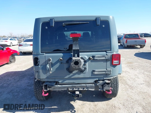 2015 Jeep Wrangler Unlimited Rubicon with VIN 1C4BJWFG7FL525724, listed as a IAAI auction lot 41394059 with 132,058 mi miles. Bid and sale history available at carsss.com. Image 17.