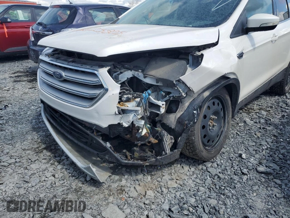 2018 Ford Escape Titanium z VIN 1FMCU9J94JUD09141, wystawiony jako Copart lot #56625805 z przebiegiem Nie podano mil oraz Szkoda całkowita • Salvage title. Historia ofert i sprzedaży dostępna na DreamBid. Obrazek 13.