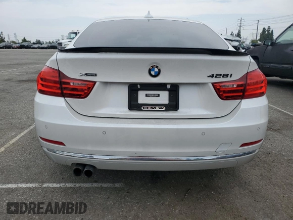 2015 BMW 4 Series 428i xDrive with VIN WBA4C9C59FD331372, listed as a Copart auction lot 58628665 with 81,245 mi miles and Salvage title. Bid and sale history available at DreamBid. Image 6.
